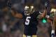 SOUTH BEND, IN - NOVEMBER 17: Manti T'eo #5 of the Notre Dame Fighting Irish encourages the crowd to cheer during a game against the Wake Forest Demon Deacons at Notre Dame Stadium on November 17, 2012 in South Bend, Indiana. Notre Dame defeated Wake Forest 38-0. (Photo by Jonathan Daniel/Getty Images)