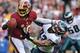 LANDOVER, MD - NOVEMBER 18: Quarterback Robert Griffin III #10 of the Washington Redskins stiff arms defensive end Jason Babin #93 of the Philadelphia Eagles in the second quarter at FedEx Field on November 18, 2012 in Landover, Maryland. (Photo by Patrick Smith/Getty Images)
