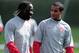 ST ALBANS, ENGLAND - MARCH 30: Theo Walcott (R) of Arsenal talks with team-mate Bacary Sagna during Arsenal training ahead of their UEFA Champions League quarter final first leg match against Barcelona at London Colney on March 30, 2010 in St Albans, England. (Photo by Shaun Botterill/Getty Images)