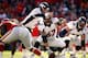 KANSAS CITY, MO - NOVEMBER 25: Quarterback Peyton Manning #18 of the Denver Broncos surveys the defense with center Dan Koppen #67 during the game against the Kansas City Chiefs at Arrowhead Stadium on November 25, 2012 in Kansas City, Missouri. (Photo by Jamie Squire/Getty Images)