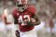 November 24, 2012; Tuscaloosa, AL, USA; Alabama Crimson Tide running back Eddie Lacy (42) carries for a touchdown against the Auburn Tigers during the first quarter at Bryant Denny Stadium. Mandatory Credit: John David Mercer-US PRESSWIRE