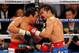 LAS VEGAS, NV - NOVEMBER 12: Juan Manuel Marquez (L) and Manny Pacquiao battle in the 10th round of their WBO world welterweight title fight at the MGM Grand Garden Arena November 12, 2011 in Las Vegas, Nevada. Pacquiao retained his title with a majority decision victory. (Photo by Ethan Miller/Getty Images)