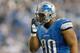 DETROIT, MI - NOVEMBER 22: Ndamukong Suh #90 of the Detroit Lions adjusts his face mask while playing the Houston Texans at Ford Field on November 22, 2012 in Detroit, Michigan. Houston won the game 34-31. (Photo by Gregory Shamus/Getty Images)
