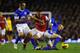 LIVERPOOL, ENGLAND - NOVEMBER 28: Leon Osman (L) and Tony Hibbert of Everton compete with Theo Walcott of Arsenal during the Barclays Premier League match between Everton and Arsenal at Goodison Park on November 28, 2012 in Liverpool, England. (Photo by Laurence Griffiths/Getty Images)