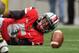 COLUMBUS, OH - NOVEMBER 24: Quarterback Braxton Miller #5 of the Ohio State Buckeyes fumbles the ball against the Michigan Wolverines at Ohio Stadium on November 24, 2012 in Columbus, Ohio. (Photo by Jamie Sabau/Getty Images)