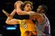 LOS ANGELES, CA - DECEMBER 10: Pau Gasol #16 of the Los Angeles Lakers is defended by Amare Stoudemire #1 of the Phoenix Suns during the second half at the Staples Center on December, 10 2008 in Los Angeles, California. NOTE TO USER: User expressly acknowledges and agrees that, by downloading and/or using this Photograph, user is consenting to the terms and conditions of the Getty Images License Agreement. (Photo by Harry How/Getty Images)