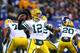 EAST RUTHERFORD, NJ - NOVEMBER 25: Quarterback Aaron Rodgers #12 of the Green Bay Packers drops back to pass against the New York Giants at MetLife Stadium on November 25, 2012 in East Rutherford, New Jersey. (Photo by Al Bello/Getty Images)