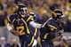 MORGANTOWN, WV - OCTOBER 20: Geno Smith #12 of the West Virginia Mountaineers hands the ball off against the Kansas State Wildcats during the game on October 20, 2012 at Mountaineer Field in Morgantown, West Virginia. (Photo by Justin K. Aller/Getty Images)