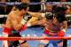 LAS VEGAS, NV - NOVEMBER 12: (L-R) Juan Manuel Marquez connects with a left to the head of Manny Pacquiao during the WBO world welterweight title fight at the MGM Grand Garden Arena on November 12, 2011 in Las Vegas, Nevada. (Photo by Ethan Miller/Getty Images)