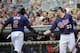 MINNEAPOLIS, MN - AUGUST 12: Justin Morneau #33 of the Minnesota Twins congratulates Denard Span #2 on scoring against the Tampa Bay Rays during the third inning on August 12, 2012 at Target Field in Minneapolis, Minnesota. (Photo by Hannah Foslien/Getty Images)