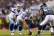 Nov 11, 2012; Philadelphia, PA, USA; Dallas Cowboys quarterback Tony Romo (9) under center Ryan Cook (63) during the first quarter against the Philadelphia Eagles at Lincoln Financial Field. The Cowboys defeated the Eagles 38-23. Mandatory Credit: Howard Smith-US PRESSWIRE