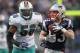FOXBORO, MA - DECEMBER 24: Wes Welker #83 of the New England Patriots catches a pass despite the defense of Kevin Burnett #56 of the Miami Dolphins in the second half at Gillette Stadium on December 24, 2011 in Foxboro, Massachusetts. (Photo by Jim Rogash/Getty Images)