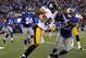 EAST RUTHERFORD, NJ - NOVEMBER 04: Antonio Brown #84 of the Pittsburgh Steelers fends off Stevie Brown #27 of the New York Giants during their game at MetLife Stadium on November 4, 2012 in East Rutherford, New Jersey. (Photo by Jeff Zelevansky/Getty Images)