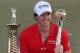 Rory McIlroy has had plenty of practice holding trophies.