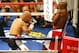 May 5, 2012; Las Vegas, NV, USA; Miguel Cotto (left) steps in as Floyd Mayweather Jr. leans on the ropes during the fourth round at MGM Grand Garden Arena. Mandatory Credit: Jake Roth-US PRESSWIRE