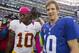 Oct 21, 2012; East Rutherford, NJ, USA; New York Giants quarterback Eli Manning (10) (right) meets Washington Redskins quarterback Robert Griffin III (10) (left) after the New York Giants 27-23, come-from-behind win over the Washington Redskins at MetLife Stadium. Mandatory Credit: Andrew Mills/THE STAR-LEDGER via US PRESSWIRE