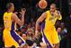 November 30, 2012; Los Angeles, CA, USA; Los Angeles Lakers power forward Antawn Jamison (4) passes the ball to point guard Chris Duhon (21) against the Denver Nuggets during the second half at Staples Center. Mandatory Credit: Gary A. Vasquez-US PRESSWIRE