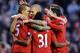 LIVERPOOL, ENGLAND - DECEMBER 01: Daniel Agger (L) of Liverpool is congratulated by his team-mates after scoring the opening goal during the Barclays Premier League match between Liverpool and Southampton at Anfield on December 1, 2012 in Liverpool, England. (Photo by Chris Brunskill/Getty Images)