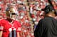 SAN FRANCISCO, CA - NOVEMBER 11: Quarterback Alex Smith #11 and head coach Jim Harbaugh of the San Francisco 49ers talk during a break in play against St. Louis Rams in the first quarter on November 11, 2012 at Candlestick Park in San Francisco, California. Smith left the game in the second quarter and the teams tied 24-24 in overtime. (Photo by Brian Bahr/Getty Images)
