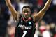NASHVILLE, TN - MARCH 18: Cashmere Wright #1 of the Cincinnati Bearcats celebrates after defeating the Florida State Seminoles during the third round of the 2012 NCAA Men's Basketball Tournament at Bridgestone Arena on March 18, 2012 in Nashville, Tennessee. (Photo by Jamie Squire/Getty Images)