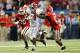 ATLANTA, GA - DECEMBER 01: Running back T.J. Yeldon #4 of the Alabama Crimson Tide stiff arms safety Bacarri Rambo #18 of the Georgia Bulldogs while rushing the ball during the third quarter of the SEC Championship Game at the Georgia Dome on December 1, 2012 in Atlanta, Georgia. (Photo by Mike Ehrmann/Getty Images)