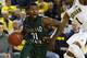 November 13, 2012; Ann Arbor, MI, USA; Cleveland State Vikings guard Charlie Lee (31) is defended by Michigan Wolverines forward Glenn Robinson III (1) in the second half of a preseason NIT game at Crisler Center. Michigan won 77-47. Mandatory Credit: Rick Osentoski-US PRESSWIRE