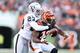 CINCINNATI, OH - NOVEMBER 25: Mohamed Sanu #12 of the Cincinnati Bengals fumbles the ball while defended by Joselio Handon #23 of the Oakland Raiders during the NFL game at Paul Brown Stadium on November 25, 2012 in Cincinnati, Ohio. (Photo by Andy Lyons/Getty Images)