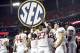 Dec 1, 2012; Atlanta, GA, USA; Alabama Crimson Tide defensive back Nick Perry (27) and teammates hold the SEC sign after winning the 2012 SEC Championship game against the Georgia Bulldogs at the Georgia Dome. Alabama won 32-28. Mandatory Credit: Paul Abell-USA TODAY Sports