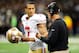 NEW ORLEANS, LA - NOVEMBER 25: Colin Kaepernick #7 of the San Francisco 49ers speaks with head coach Jim Harbaugh during a game against the New Orleans Saints at the Mercedes-Benz Superdome on November 25, 2012 in New Orleans, Louisiana. (Photo by Stacy Revere/Getty Images)