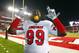 PISCATAWAY, NJ - NOVEMBER 29: Jamaine Brooks #99 of the Louisville Cardinals takes a bite out of an orange after beating the Rutgers Scarlet Knights 20-17 to win the Big East championship in a game at High Point Solutions Stadium on November 29, 2012 in Piscataway, New Jersey. The Cardinals are anticipating a bid to the Orange Bowl. (Photo by Rich Schultz/Getty Images)