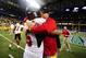 Nov 30, 2012; Detroit, MI, USA; Northern Illinois Huskies defensive end Sean Progar (95) celebrates with head coach Dave Doeren after defeating Kent State Golden Flashes 44-37 in double overtime to win the 2012 MAC Championship at Ford Field. Mandatory Credit: Andrew Weber-US PRESSWIRE