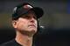 Harbaugh faces the first real controversy of his coaching career.