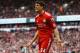LIVERPOOL, ENGLAND - MARCH 03: Martin Kelly of Liverpool reacts during the Barclays Premier League match between Liverpool and Arsenal at Anfield on March 3, 2012 in Liverpool, England. (Photo by Clive Mason/Getty Images)