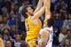 February 13, 2011; Orlando FL, USA; Los Angeles Lakers power forward Pau Gasol (16) shoots as Orlando Magic power forward Ryan Anderson (33) defends during the second half at Amway Center. Mandatory Credit: Kim Klement-USA TODAY Sports