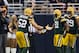 ST. LOUIS, MO - OCTOBER 21: Outside linebacker Clay Matthews #52 and strong safety Charles Woodson #21 of the Green Bay Packers celebrate after making a tackle for a loss during the game against the St. Louis Rams at the Edward Jones Dome on October 21, 2012 in St. Louis, Missouri. (Photo by David Welker/Getty Images)
