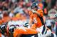 DENVER, CO - DECEMBER 2: Quarterback Peyton Manning #18 of the Denver Broncos adjusts the play at the line of scrimmage during a game against the Tampa Bay Buccaneers at Sports Authority Field Field at Mile High on December 2, 2012 in Denver, Colorado. (Photo by Dustin Bradford/Getty Images)