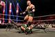 Ryback puts WWE Champion CM Punk through a table. (Courtesy of WWE.com)