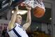 Feb. 11, 2012; Logan, UT, USA; Utah State Aggies guard Danny Berger (12) dunks the ball against the New Mexico State Aggies during the first half in the Dee Glen Smith Spectrum. Mandatory Credit: Douglas C. Pizac-USA TODAY Sports
