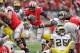 COLUMBUS, OH - NOVEMBER 24: Quarterback Braxton Miller #5 of the Ohio State Buckeyes controls the ball against the Michigan Wolverines at Ohio Stadium on November 24, 2012 in Columbus, Ohio. (Photo by Jamie Sabau/Getty Images)