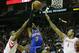 HOUSTON, TX - NOVEMBER 23: Carmelo Anthony #7 of the New York Knicks dunks over Terrence Jones #6 and Greg Smith #4 of the Houston Rockets at the Toyota Center on November 23, 2012 in Houston, Texas. NOTE TO USER: User expressly acknowledges and agrees that, by downloading and or using this photograph, User is consenting to the terms and conditions of the Getty Images License Agreement. (Photo by Scott Halleran/Getty Images)
