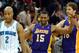 Mar 14, 2012; New Orleans, LA, USA; Los Angeles Lakers small forward Metta World Peace (15), center, celebrates a shot block in overtime with teammate Pau Gasol (16) as New Orleans Hornets point guard Jarrett Jack (2) walks away during their game at the New Orleans Arena. Mandatory Credit: Chuck Cook-USA TODAY Sports