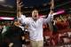 LANDOVER, MD - SEPTEMBER 29: Head coach Butch Jones of the Cincinnati Bearcats directs his player to sing along with the marching band after they defeated the Virginia Tech Hokies 27-24 at FedExField on September 29, 2012 in Landover, Maryland. (Photo by Jonathan Ernst/Getty Images)
