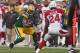 GREEN BAY, WI - NOVEMBER 04: Alex Green #20 of the Green Bay Packers runs as Adrian Wilson #24 of the Arizona Cardinals closes in at Lambeau Field on November 4, 2012 in Green Bay, Wisconsin. The Packers defeated the Cardinals 31-17. (Photo by Jonathan Daniel/Getty Images)