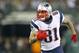 EAST RUTHERFORD, NJ - NOVEMBER 22: Tight end Aaron Hernandez #81 of the New England Patriots runs after making a catch against the New York Jets in a game at MetLife Stadium on November 22, 2012 in East Rutherford, New Jersey. The Patriots defeated the Jets 49-19. (Photo by Rich Schultz /Getty Images)