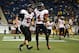 Nov 30, 2012; Detroit, MI, USA; Northern Illinois Huskies quarterback Jordan Lynch (6) celebrates with wide receiver Da'Ron Brown (4) after rushing for a touchdown in the fourth quarter of the 2012 MAC Championship against the Kent State Golden Flashes at Ford Field. Mandatory Credit: Andrew Weber-USA TODAY Sports
