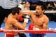 LAS VEGAS, NV - NOVEMBER 12: Manny Pacquiao (R) throws a right at Juan Manuel Marquez during the fourth round of their WBO world welterweight title fight at the MGM Grand Garden Arena November 12, 2011 in Las Vegas, Nevada. Pacquiao retained his title with a majority decision victory. (Photo by Ethan Miller/Getty Images)