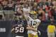 HOUSTON, TX - OCTOBER 14: Aaron Rodgers #12 of the Green Bay Packers takes a hit from Brooks Reed #58 of the Houston Texans as he releases the pass in the fourth quarter at Reliant Stadium on October 14, 2012 in Houston, Texas. Green Bay Packers defeated Houston 42-24. (Photo by Bob Levey/Getty Images)
