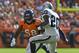 September 30 2012; Denver, CO, USA; Denver Broncos outside linebacker Von Miller (58) chases down Oakland Raiders running back Darren McFadden (20) during second quarter of the game at Sports Authority Field. Mandatory Credit: Ron Chenoy-USA TODAY Sports