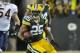GREEN BAY, WI - DECEMBER 25: Ryan Grant #25 of the Green Bay Packers is pursued by Brian Urlacher #54 and Major Wright #27 of the Chicago Bears on December 25, 2011 at Lambeau Field in Green Bay, Wisconsin. (Photo by David Banks/Getty Images)