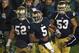 SOUTH BEND, IN - NOVEMBER 03: Everett Golson #5, Braxston Cave #52 and Justin Utupo #53 of the Notre Dame Fighting Irish celebrate after Golson ran for the game-winning touchdown against the Pittsburgh Panthers at Notre Dame Stadium on November 3, 2012 in South Bend, Indiana. Notre Dame defeated Pittsburgh 29-26 in triple overtime. (Photo by Jonathan Daniel/Getty Images)